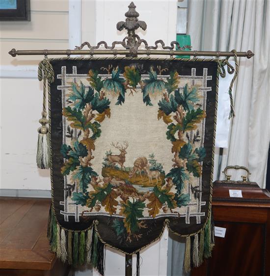 A Victorian brass polescreen with beadwork banner